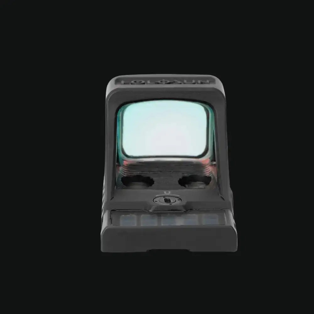 Compact black reflex sight with square lens window and front adjustment buttons