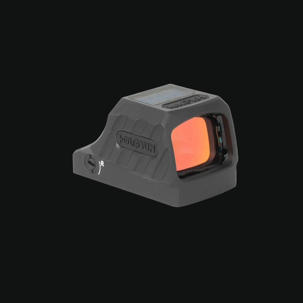 Gray pistol reflex sight angled, circle-dot window with bright orange reflection
