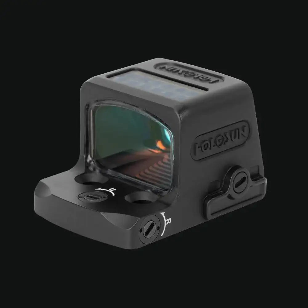 Enclosed solar reflex sight angled view showing side controls and tinted display window, gray
