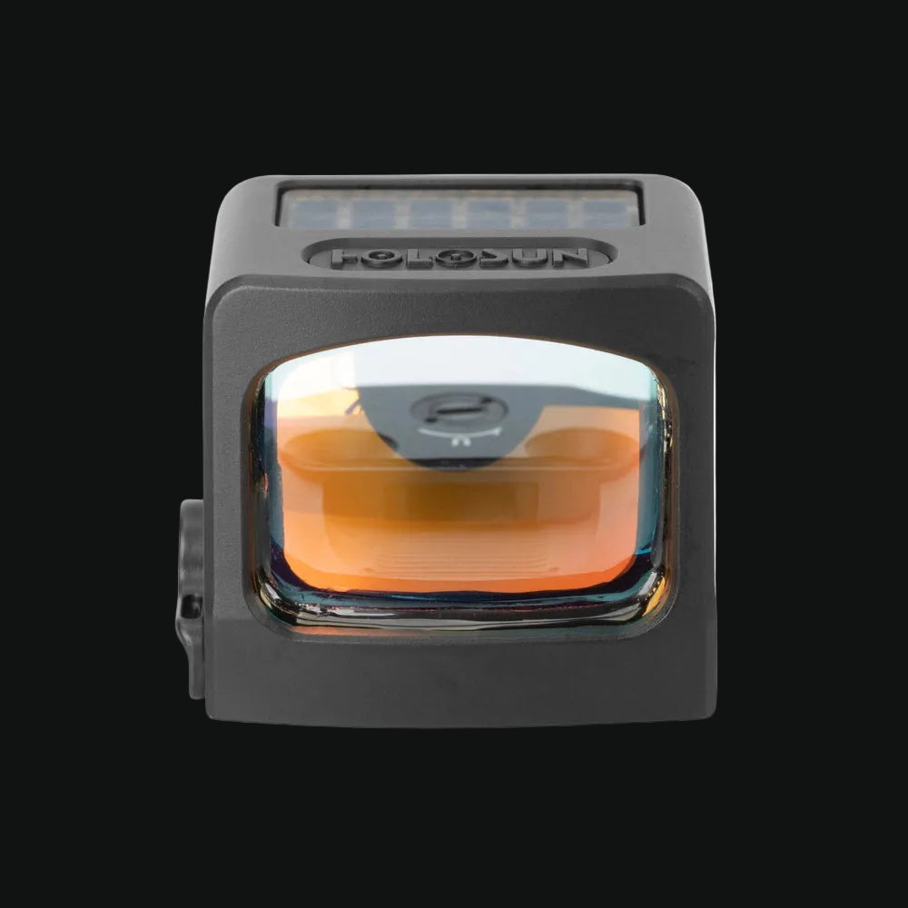 Enclosed reflex sight, gray body with front window and tinted orange lens