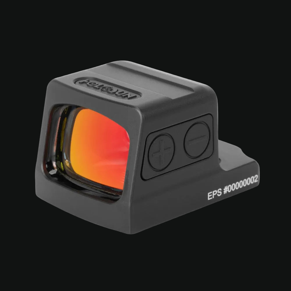 Enclosed reflex dot sight with orange-tinted window, adjustment buttons, gray body