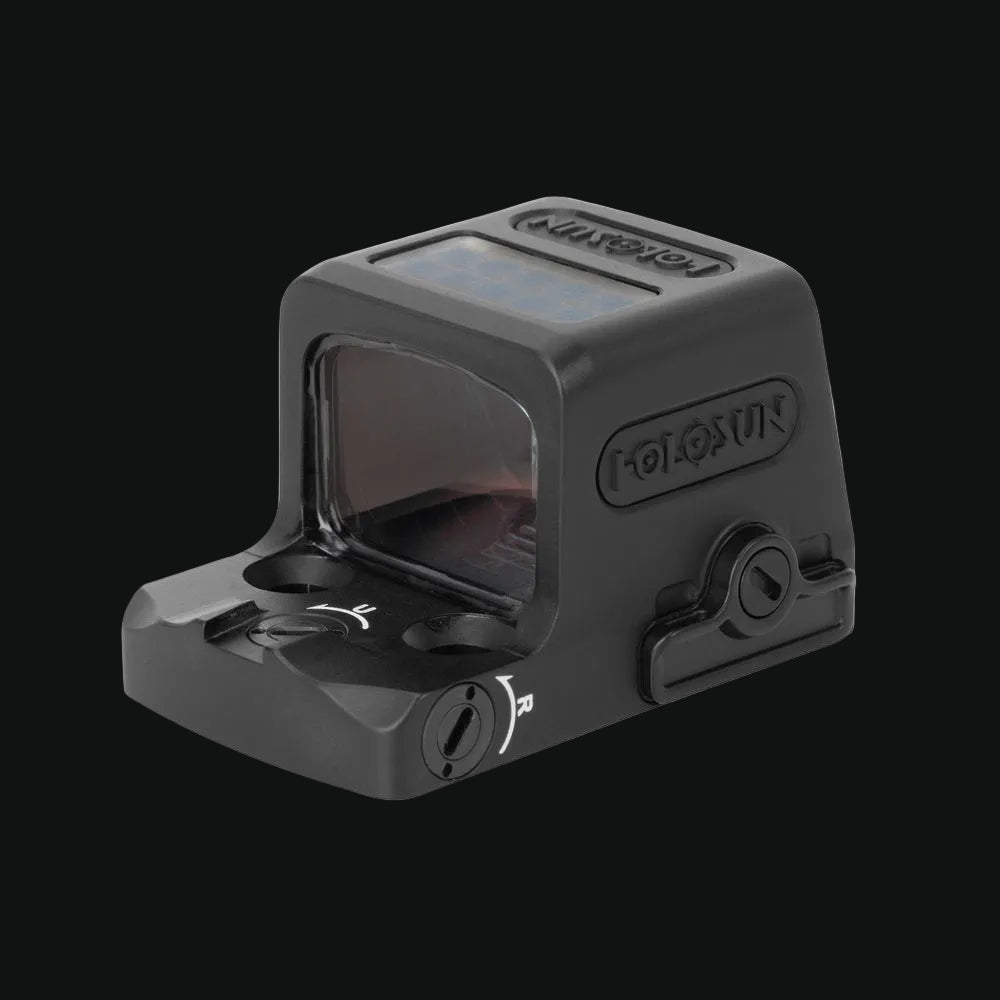 Enclosed solar reflex red-dot sight, angled view with top panel and front window