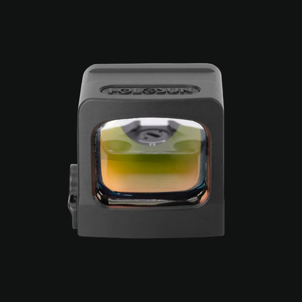 Enclosed red dot sight with rectangular lens window and protective housing, dark gray