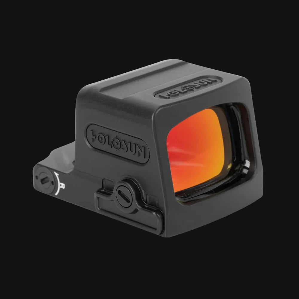 Enclosed red dot sight with orange-tinted front lens window