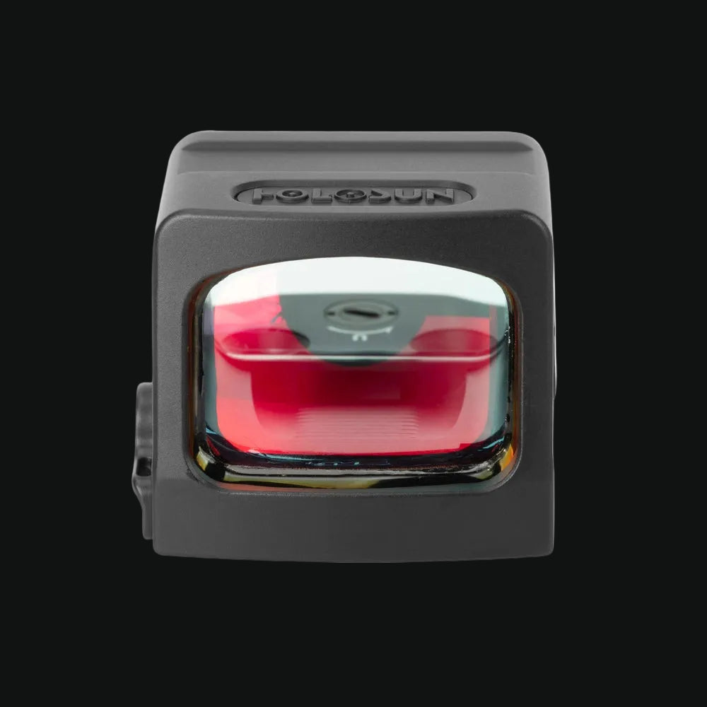 Enclosed reflex dot sight front view with red illuminated reticle window, gray housing