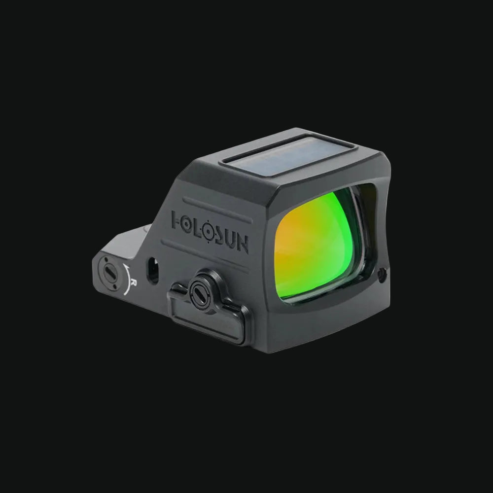 Holosun HE407C-X3 dot sight showing green illuminated reticle through lens