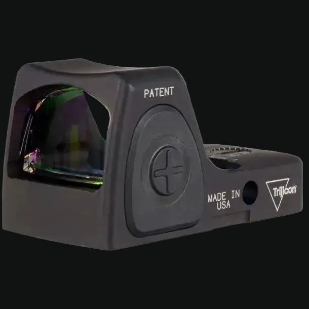 Black red dot sight with PATENT mark and illuminated lens window, side controls.