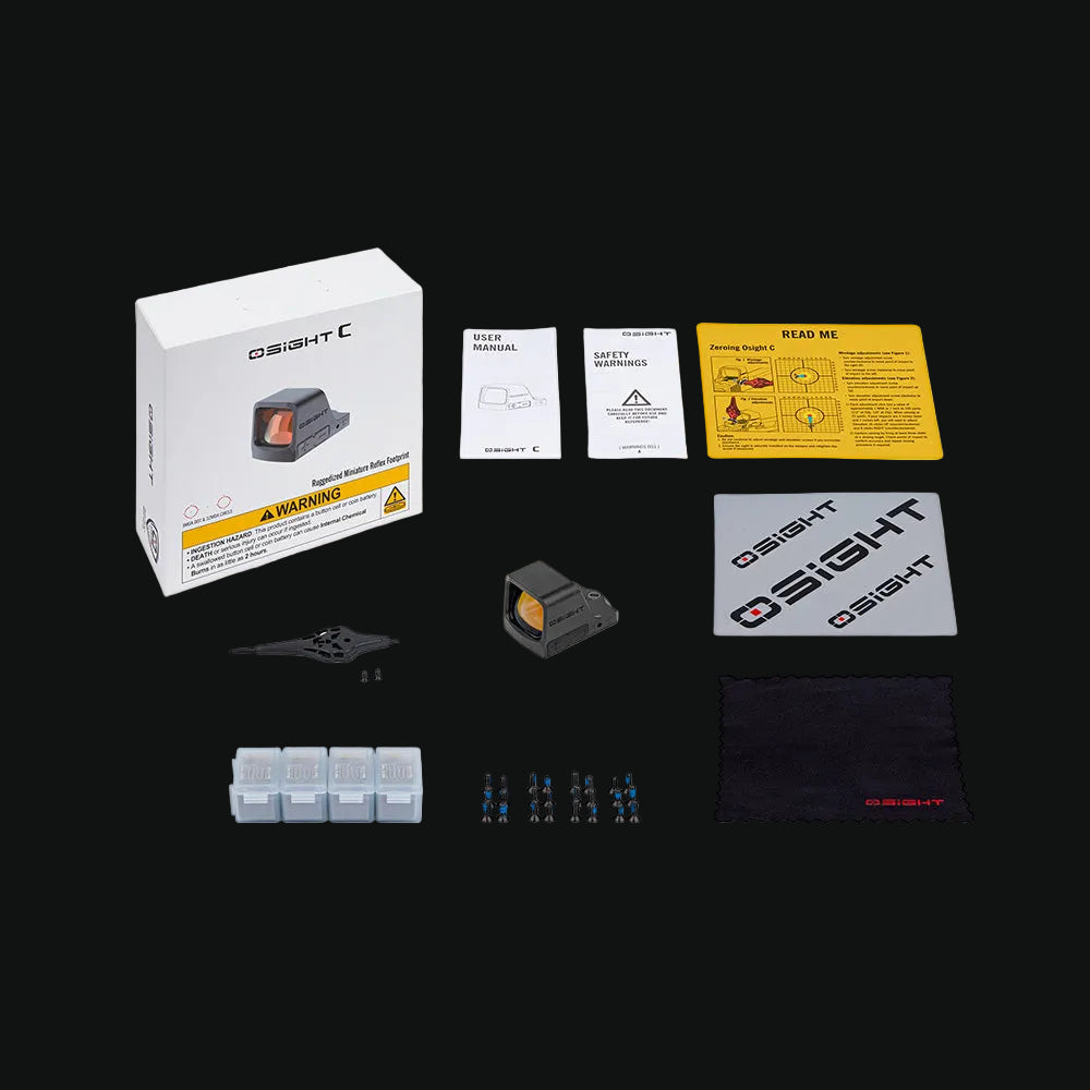 Red dot sight kit with box, manuals, and mounting accessories