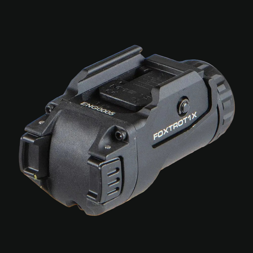 Weapon light with rail-mount base, side vents, and FOXTROTX branding